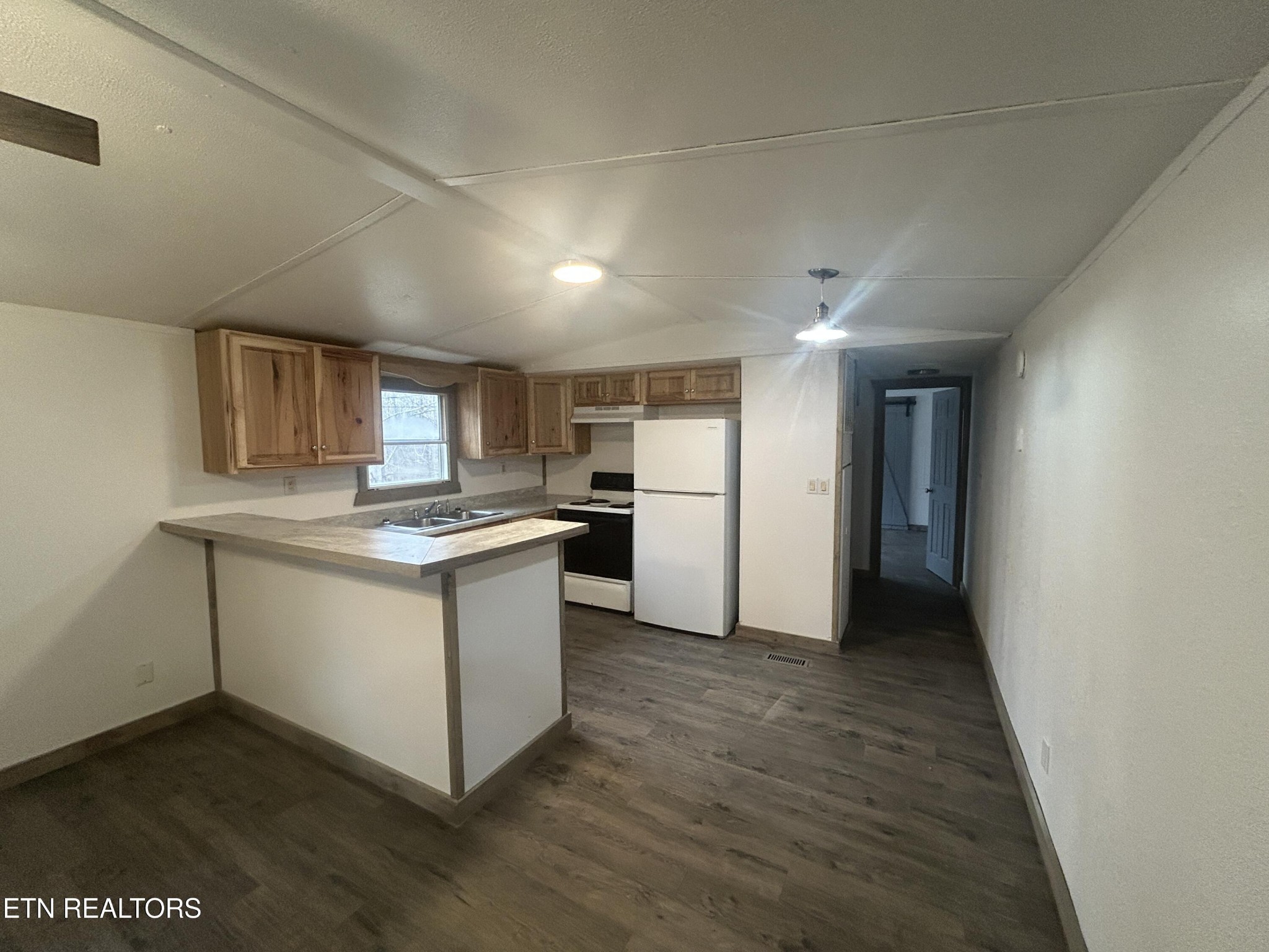 994 Pioneer Road Grimsley, TN 38565 - Photo 11 of 20 a kitchen with a refrigerator and a stove top oven