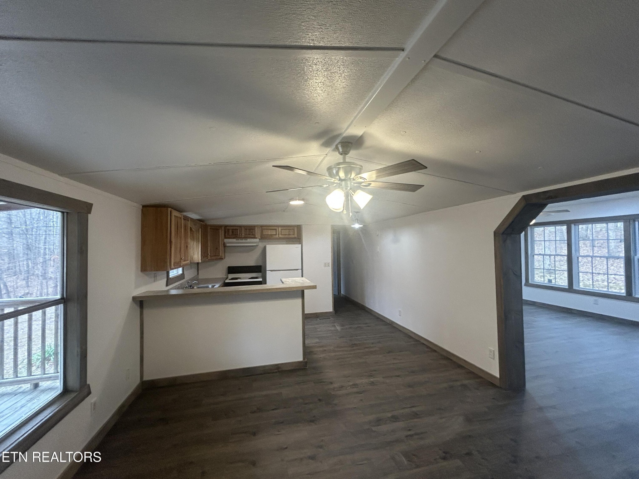 994 Pioneer Road Grimsley, TN 38565 - Photo 12 of 20 a kitchen with stainless steel appliances granite countertop a stove cabinets and wooden floor