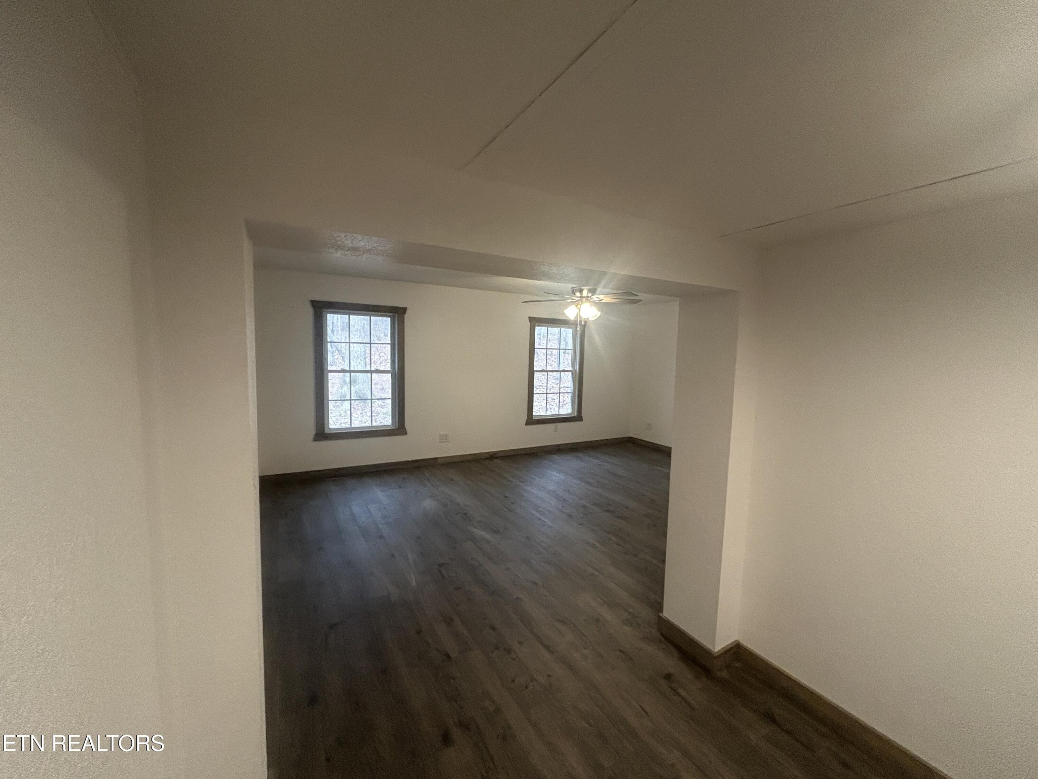 994 Pioneer Road Grimsley, TN 38565 - Photo 13 of 20 an empty room with wooden floor and windows