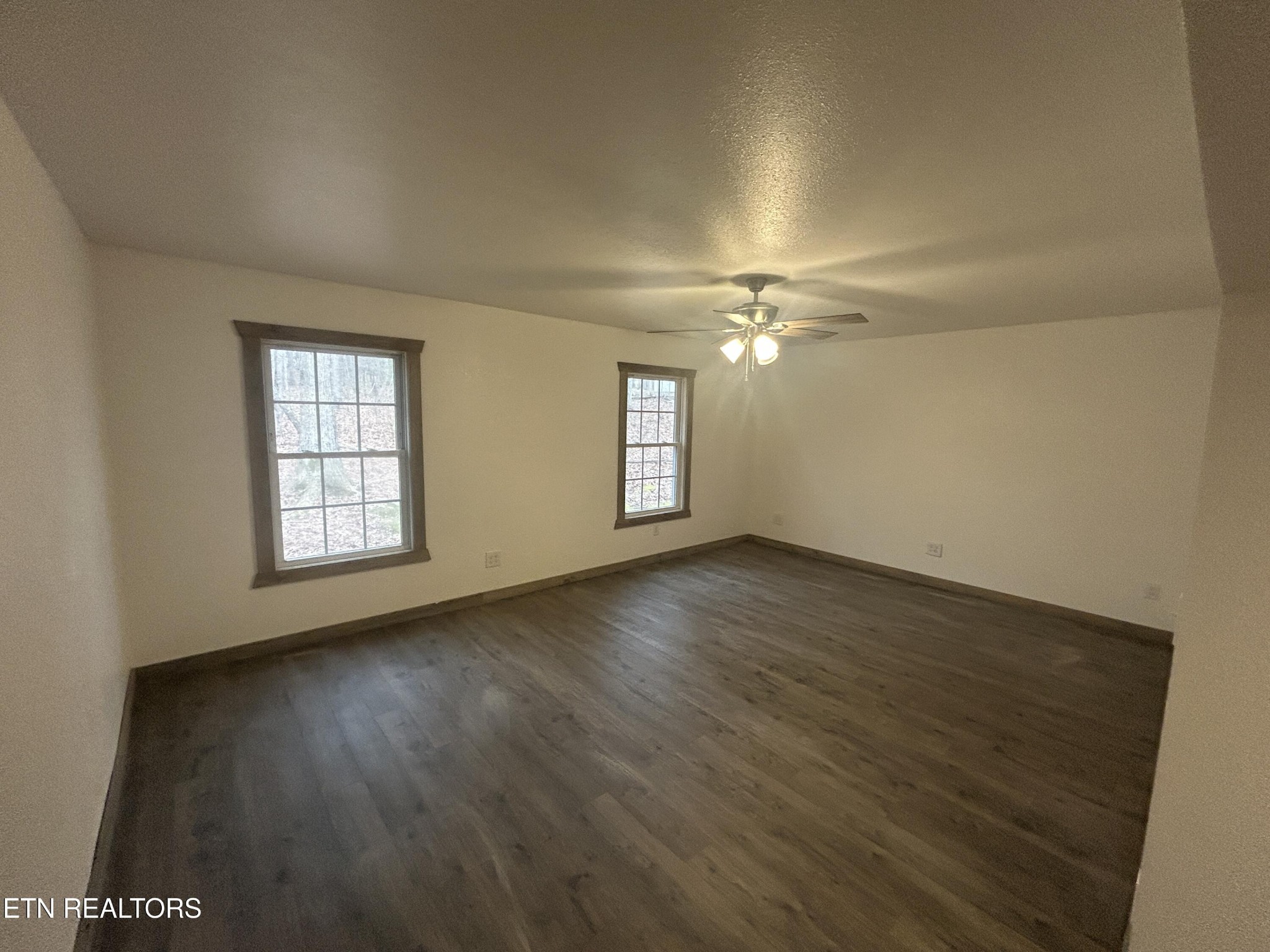 994 Pioneer Road Grimsley, TN 38565 - Photo 17 of 20 an empty room with wooden floor and windows