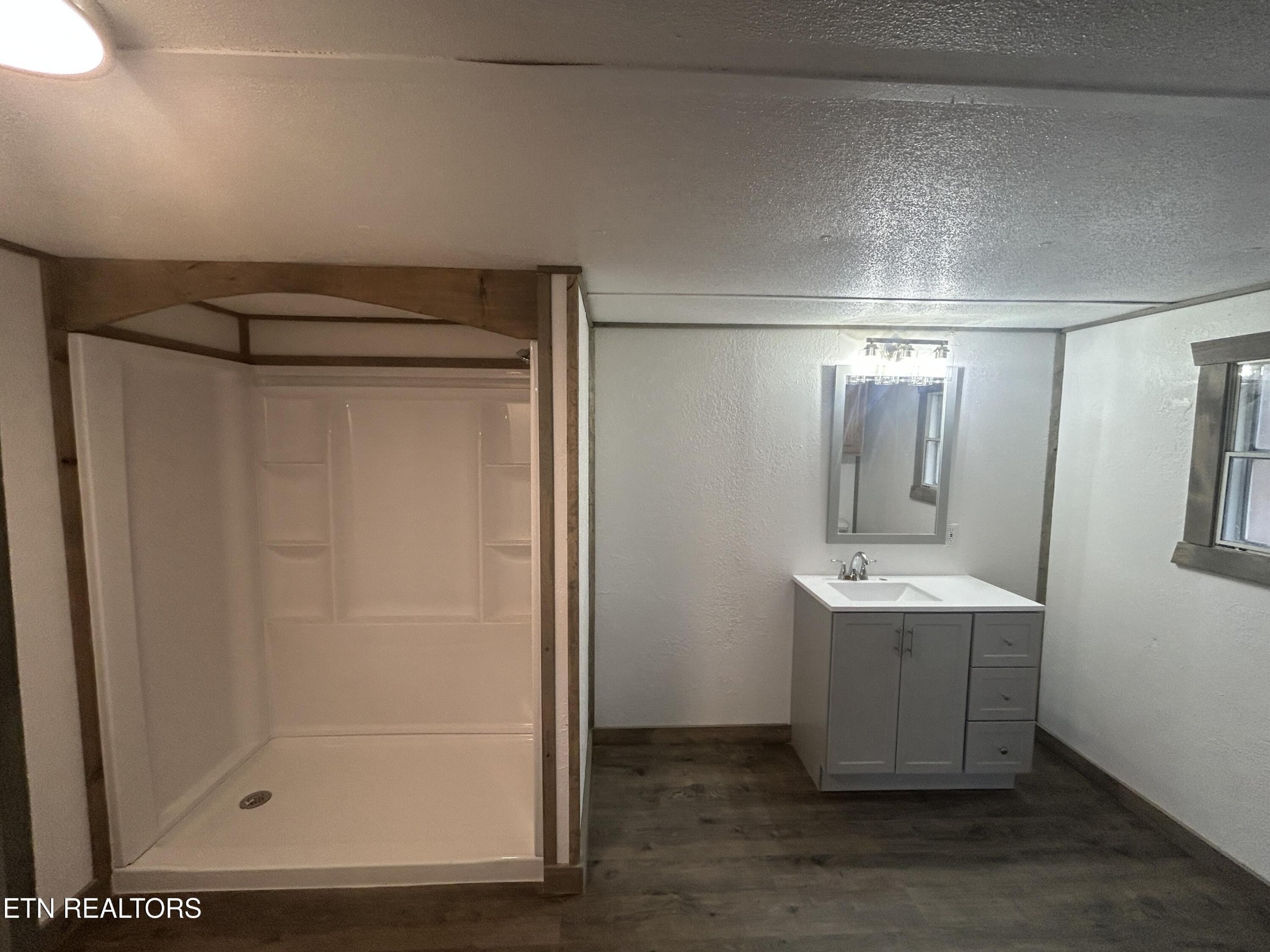 994 Pioneer Road Grimsley, TN 38565 - Photo 20 of 20 a bathroom with a shower and a sink