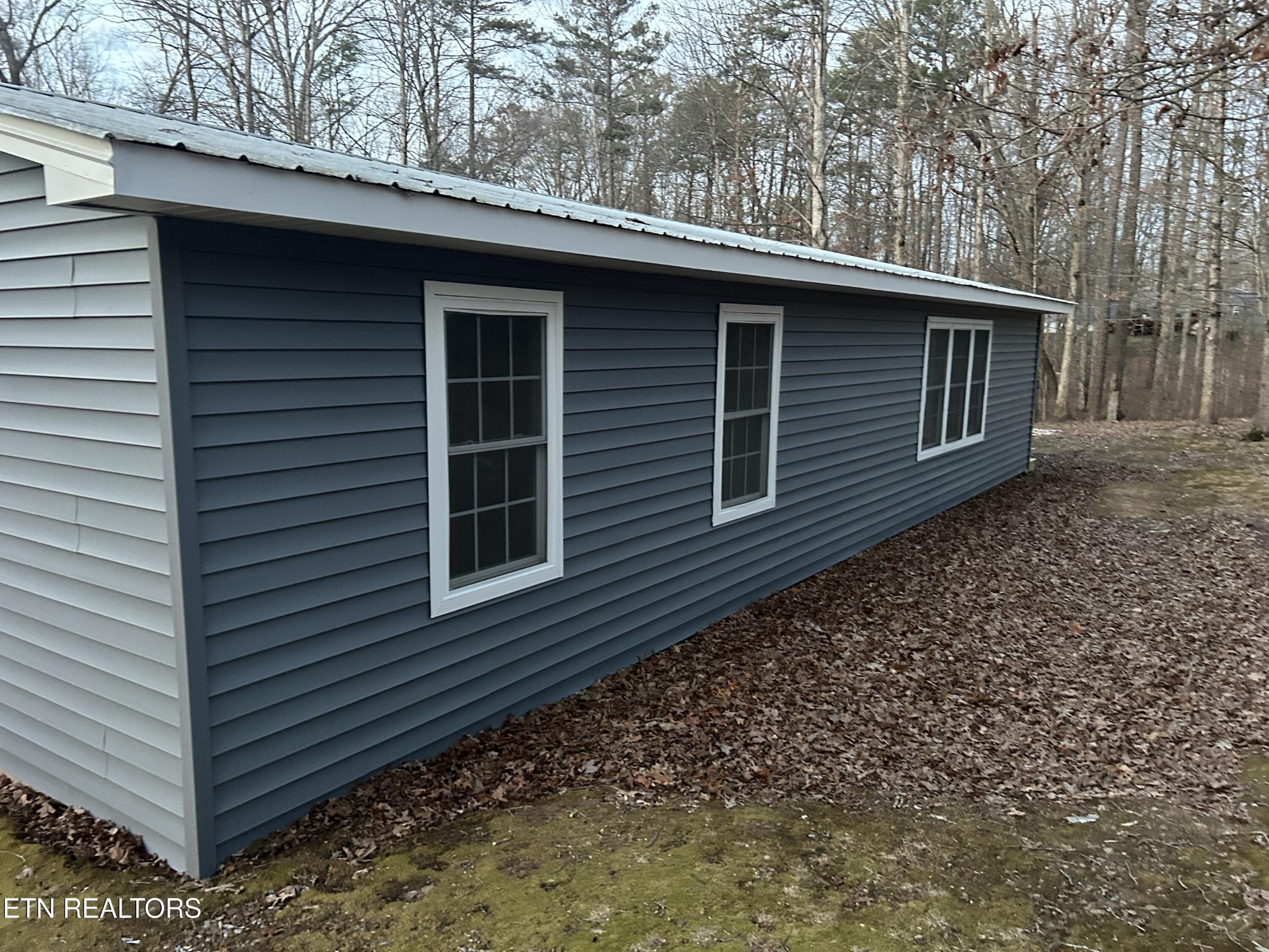 994 Pioneer Road Grimsley, TN 38565 - Photo 4 of 20 a side view of a house