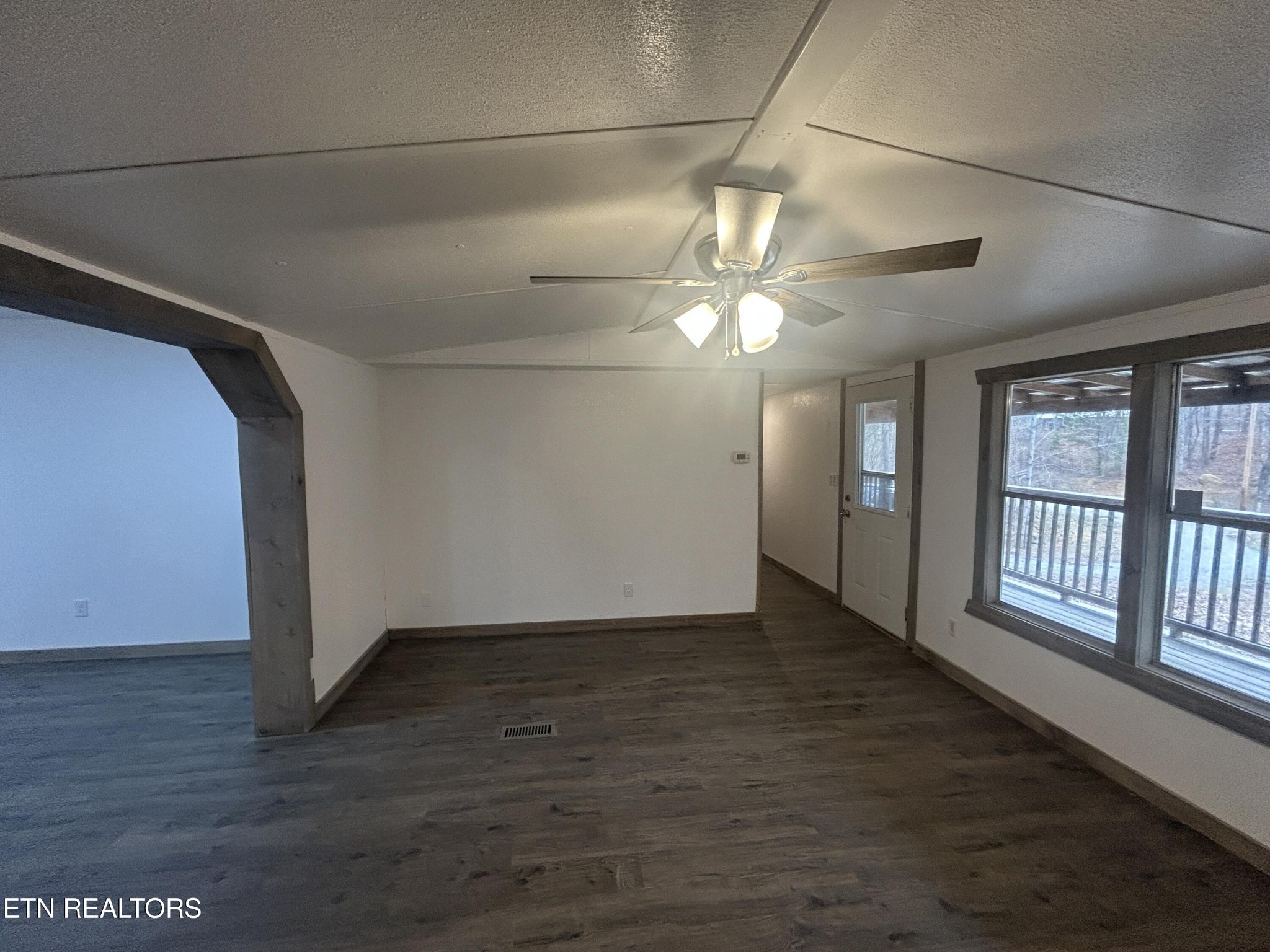 994 Pioneer Road Grimsley, TN 38565 - Photo 5 of 20 a view of an empty room with a window and wooden floor