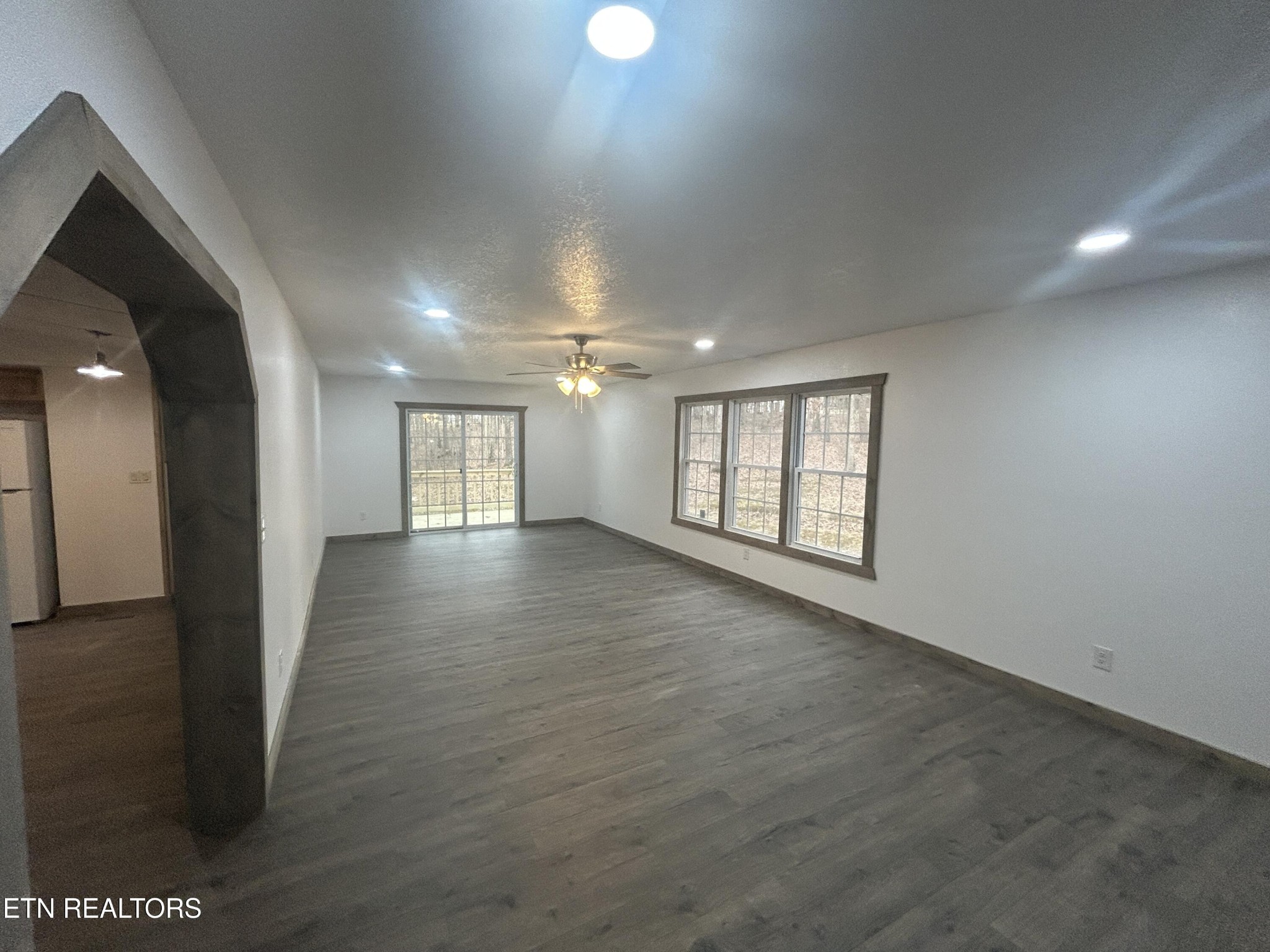 994 Pioneer Road Grimsley, TN 38565 - Photo 8 of 20 a view of an empty room with wooden floor and a window