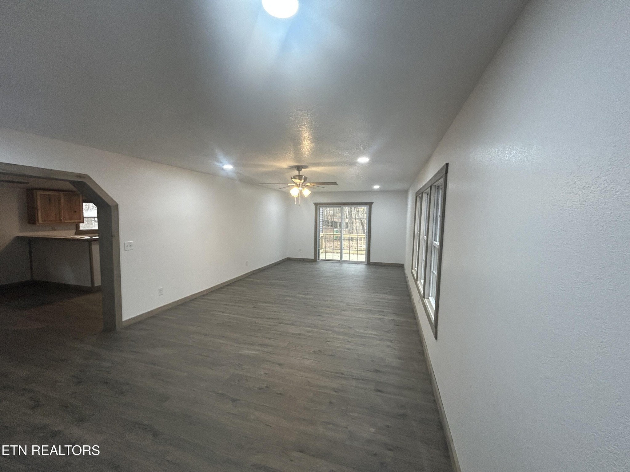 994 Pioneer Road Grimsley, TN 38565 - Photo 9 of 20 an empty room with wooden floor and windows