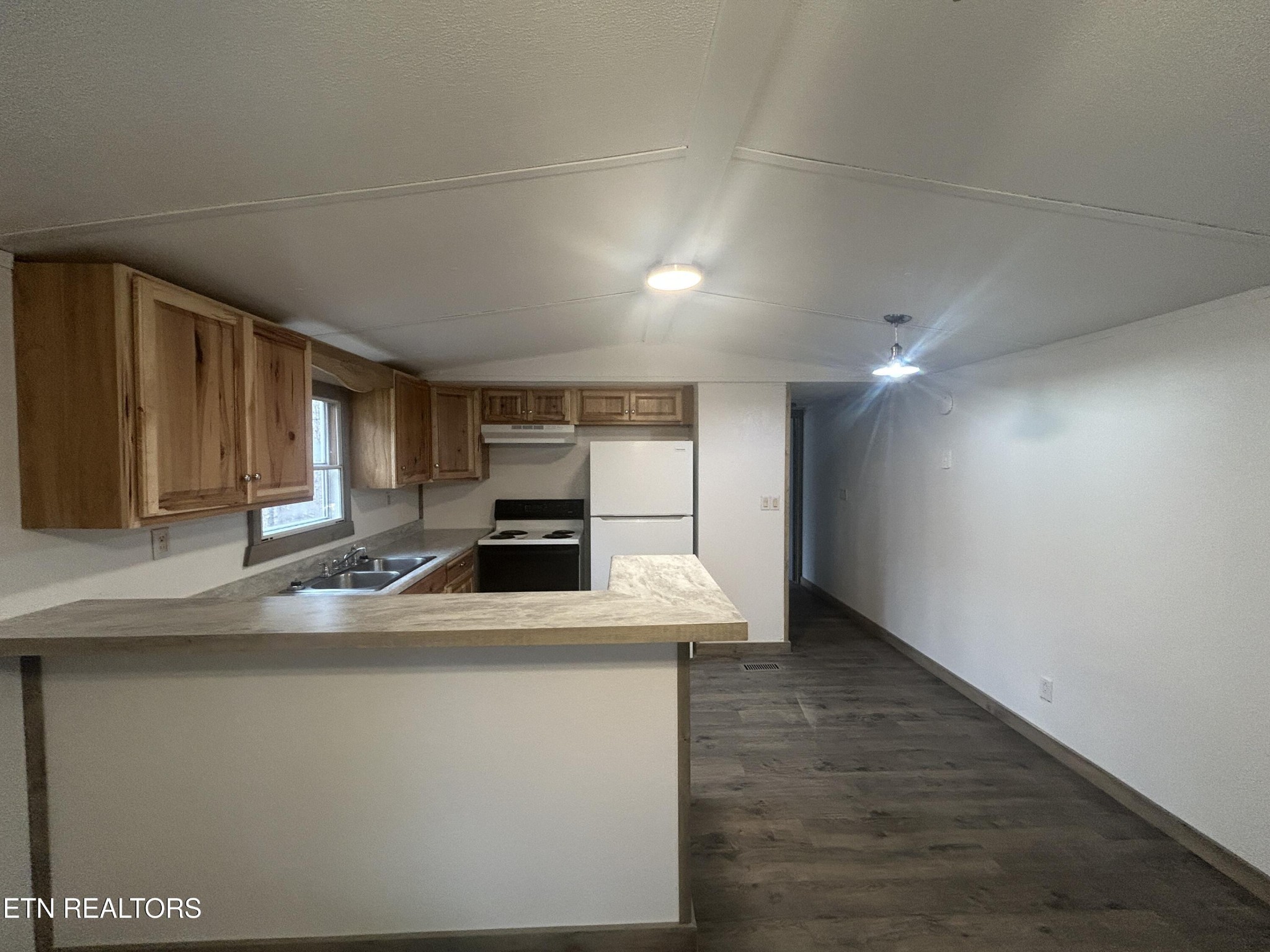 994 Pioneer Road Grimsley, TN 38565 - Photo 10 of 20 a kitchen with kitchen island a sink appliances and a counter top space