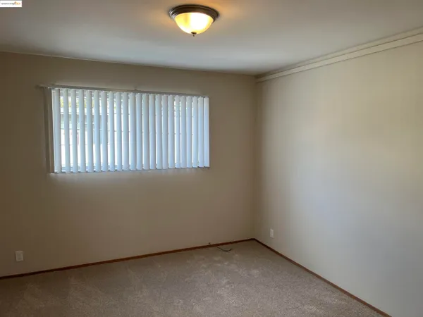 an empty room with closet area