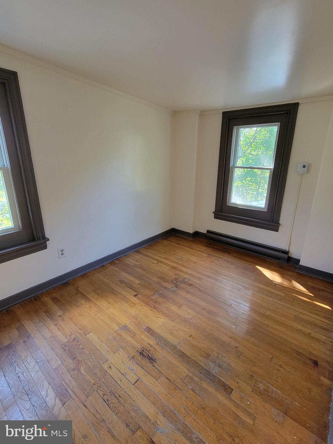 40 Star Road Hereford, PA 18056 - Photo 14 of 20 an empty room with wooden floor and windows