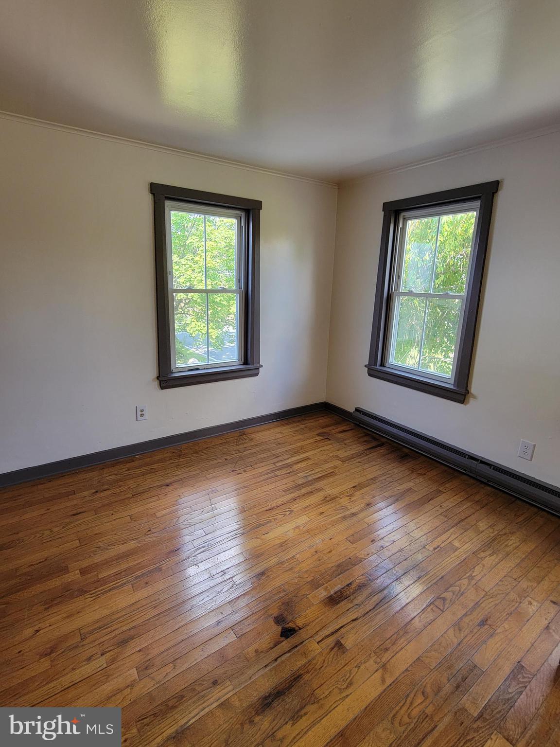 40 Star Road Hereford, PA 18056 - Photo 16 of 20 a view of an empty room with wooden floor and a window