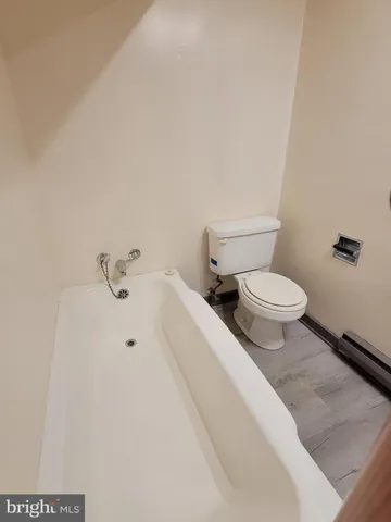 a bathroom with a toilet and a sink