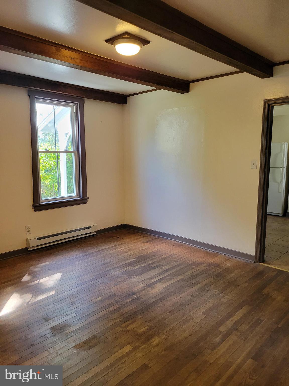 40 Star Road Hereford, PA 18056 - Photo 8 of 20 an empty room with wooden floor and windows