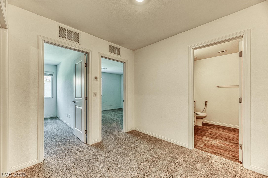 12105 Scarlet Ember Road, Unit 2 Las Vegas, NV 89183 - Photo 11 of 24 A well-maintained interior offers practical living spaces with durable flooring throughout.