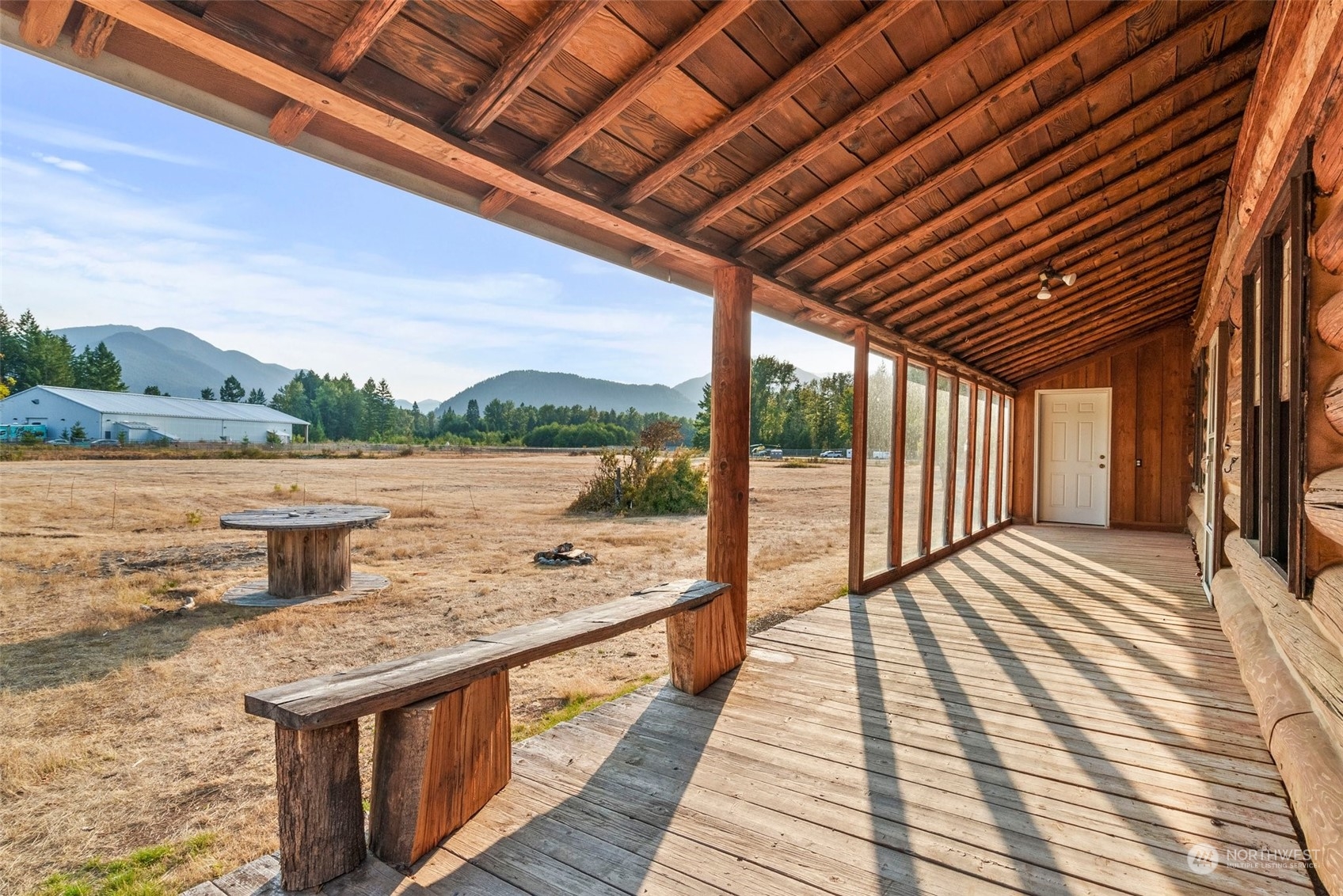 111 Huntington Road Packwood, WA 98361 - Photo 12 of 40 a view of balcony with wooden floor