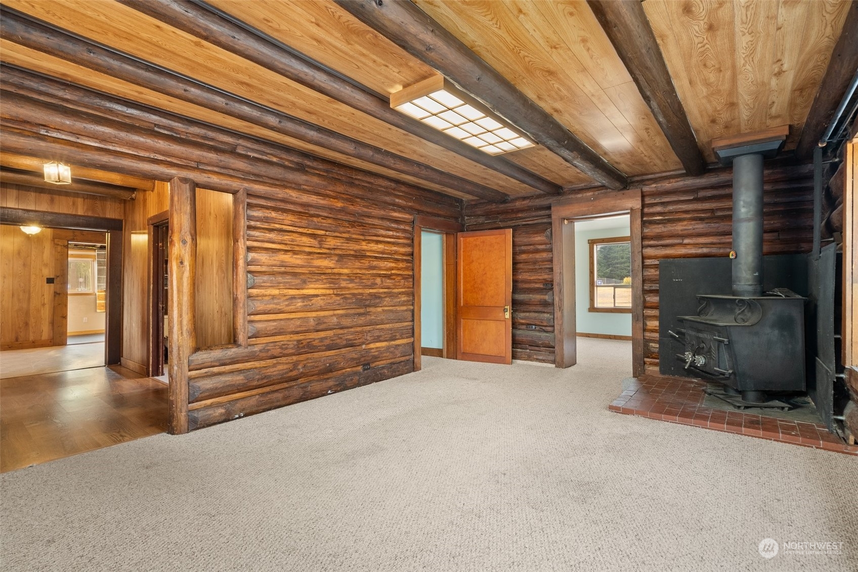 111 Huntington Road Packwood, WA 98361 - Photo 15 of 40 a view of an empty room with a fireplace