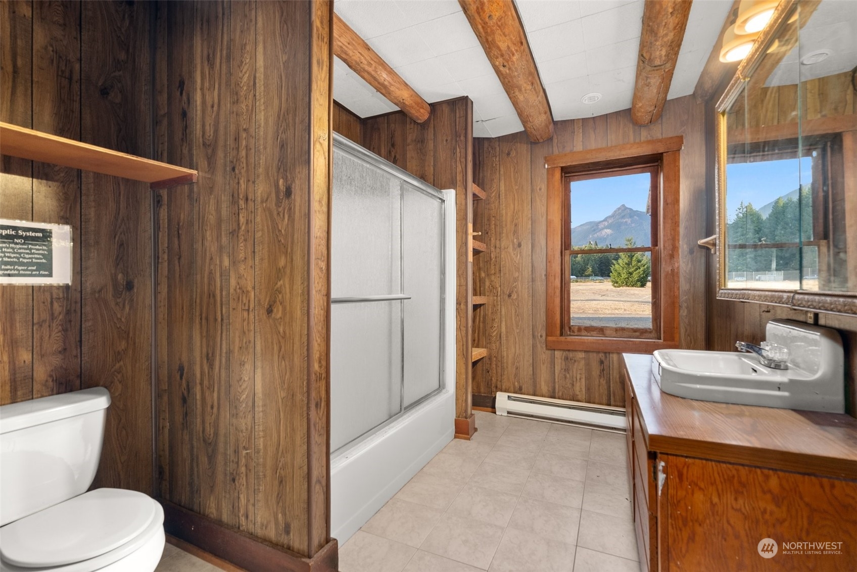 111 Huntington Road Packwood, WA 98361 - Photo 18 of 40 a bathroom with a sink toilet and shower