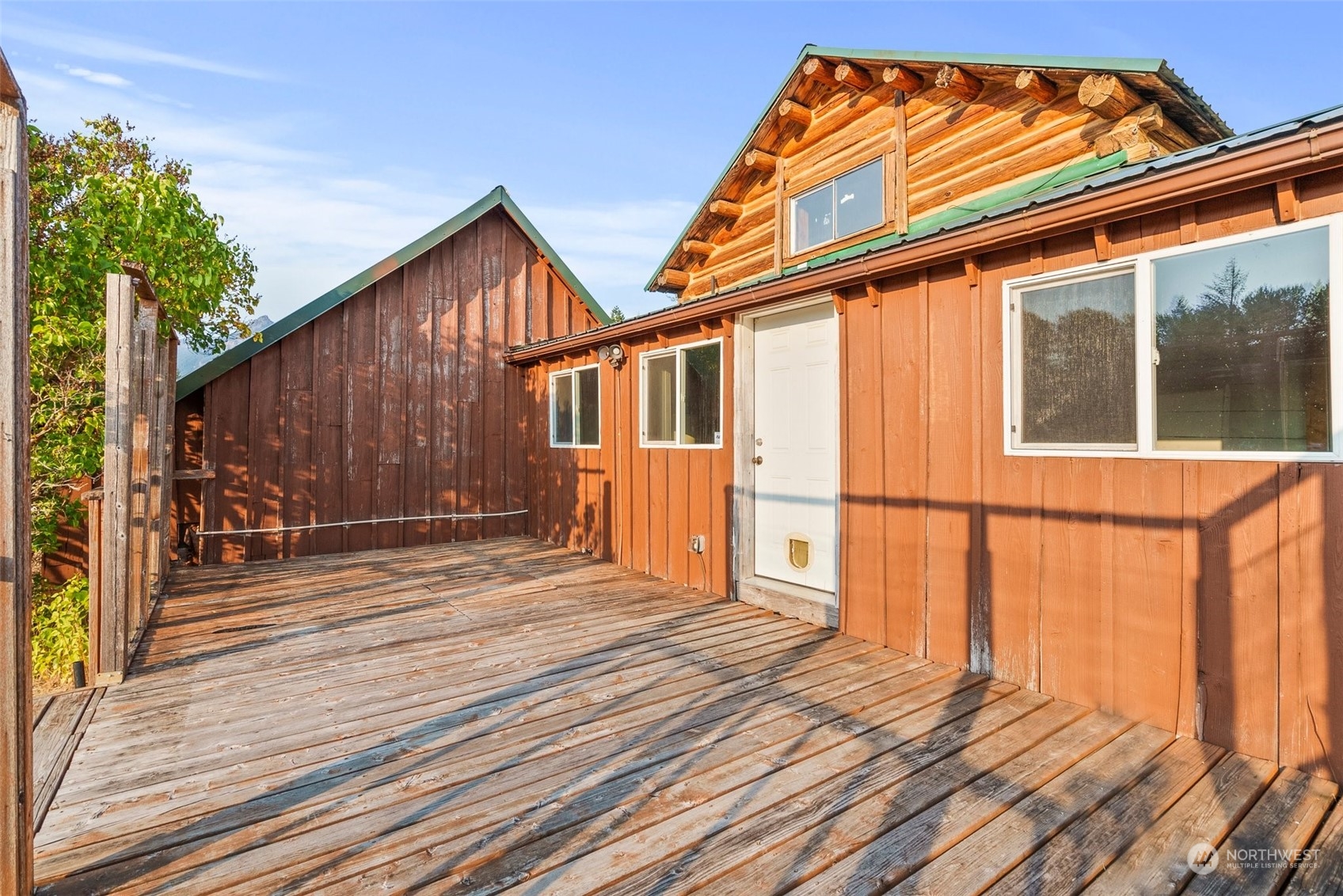 111 Huntington Road Packwood, WA 98361 - Photo 25 of 40 a backyard of a house with wooden floor and fence with a barbeque grill