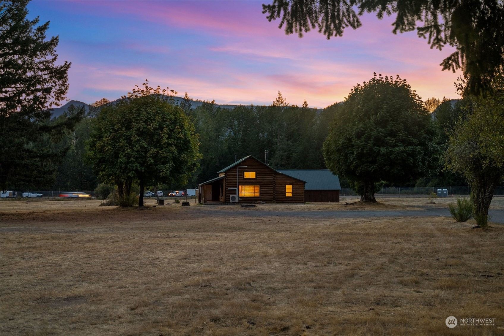 111 Huntington Road Packwood, WA 98361 - Photo 8 of 40 a front view of a house with a yard and garage