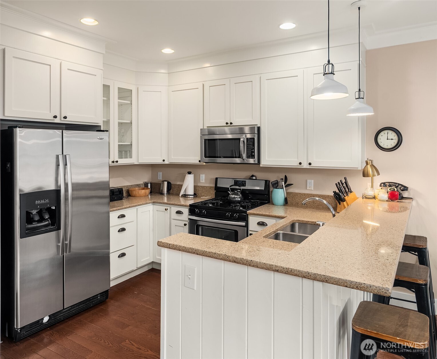 24 Float Lane Pacific Beach, WA 98571 - Photo 3 of 23 a kitchen with a refrigerator a microwave and cabinets