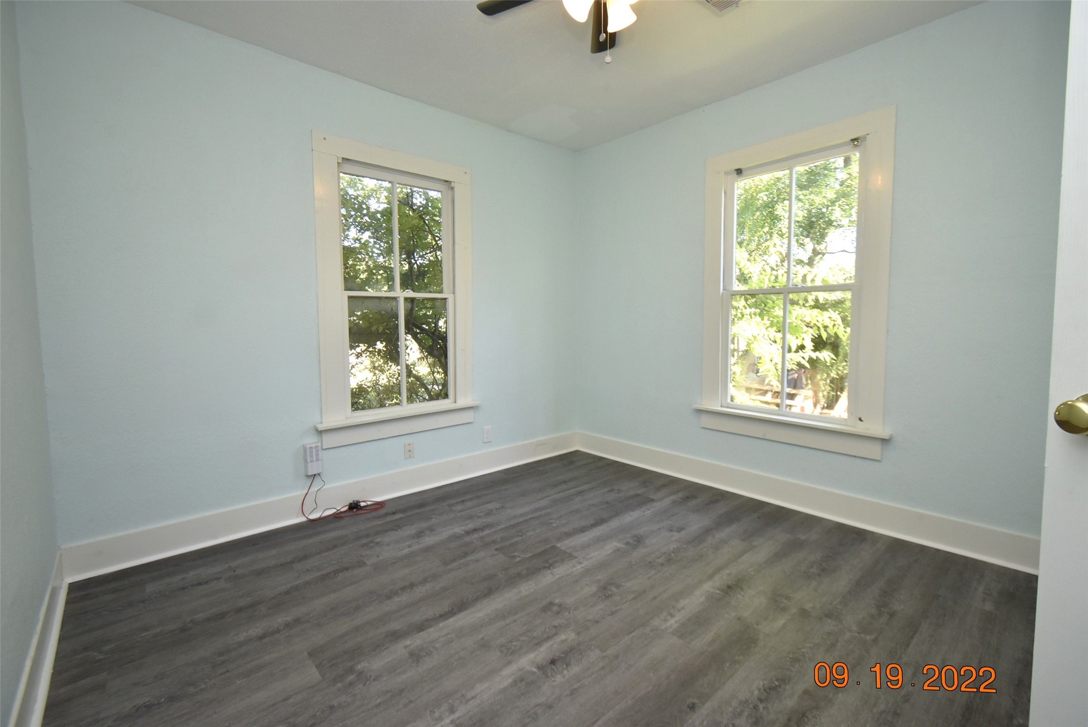 5405 Avenue R Galveston, TX 77551 - Photo 11 of 30 a view of an empty room with wooden floor and a window