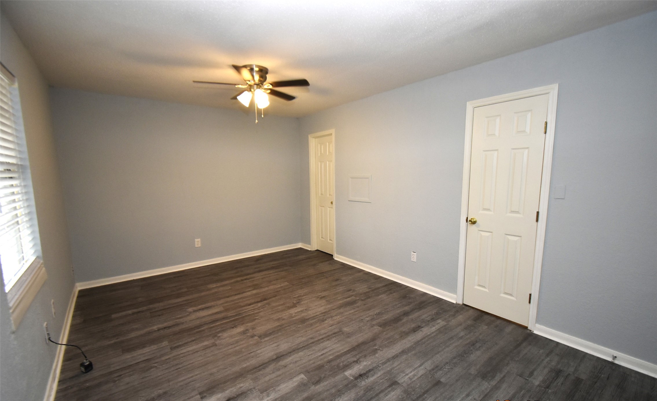 5405 Avenue R Galveston, TX 77551 - Photo 14 of 30 wooden floor in an empty room with a window