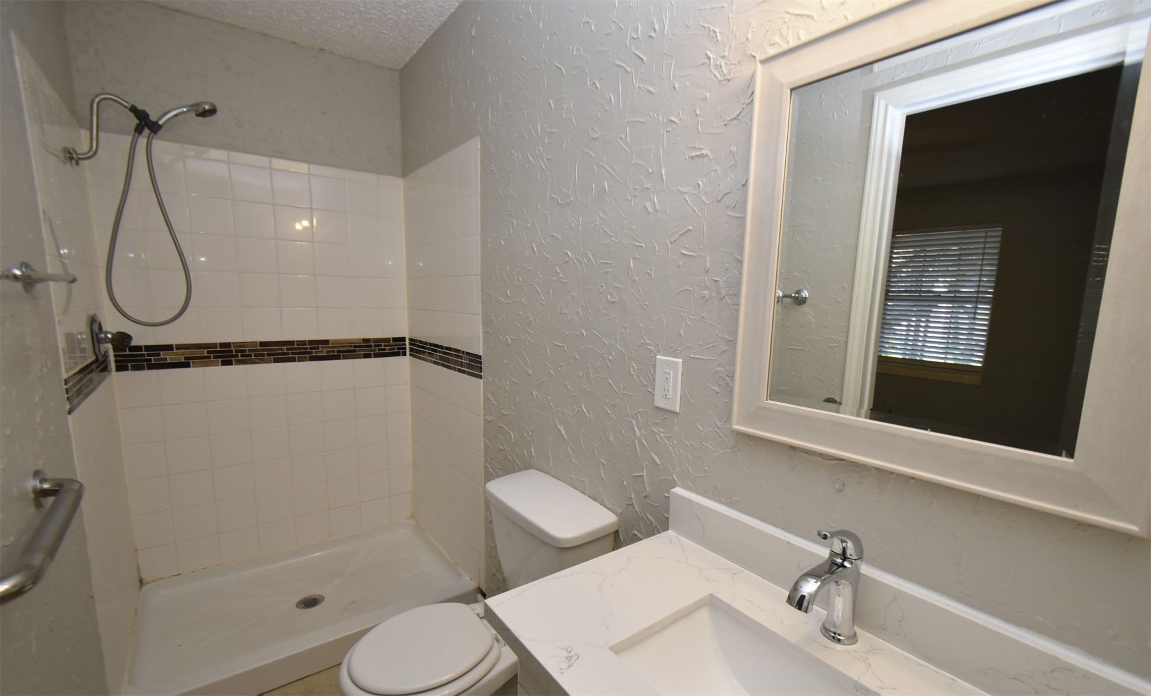 5405 Avenue R Galveston, TX 77551 - Photo 15 of 30 a bathroom with a toilet sink and shower