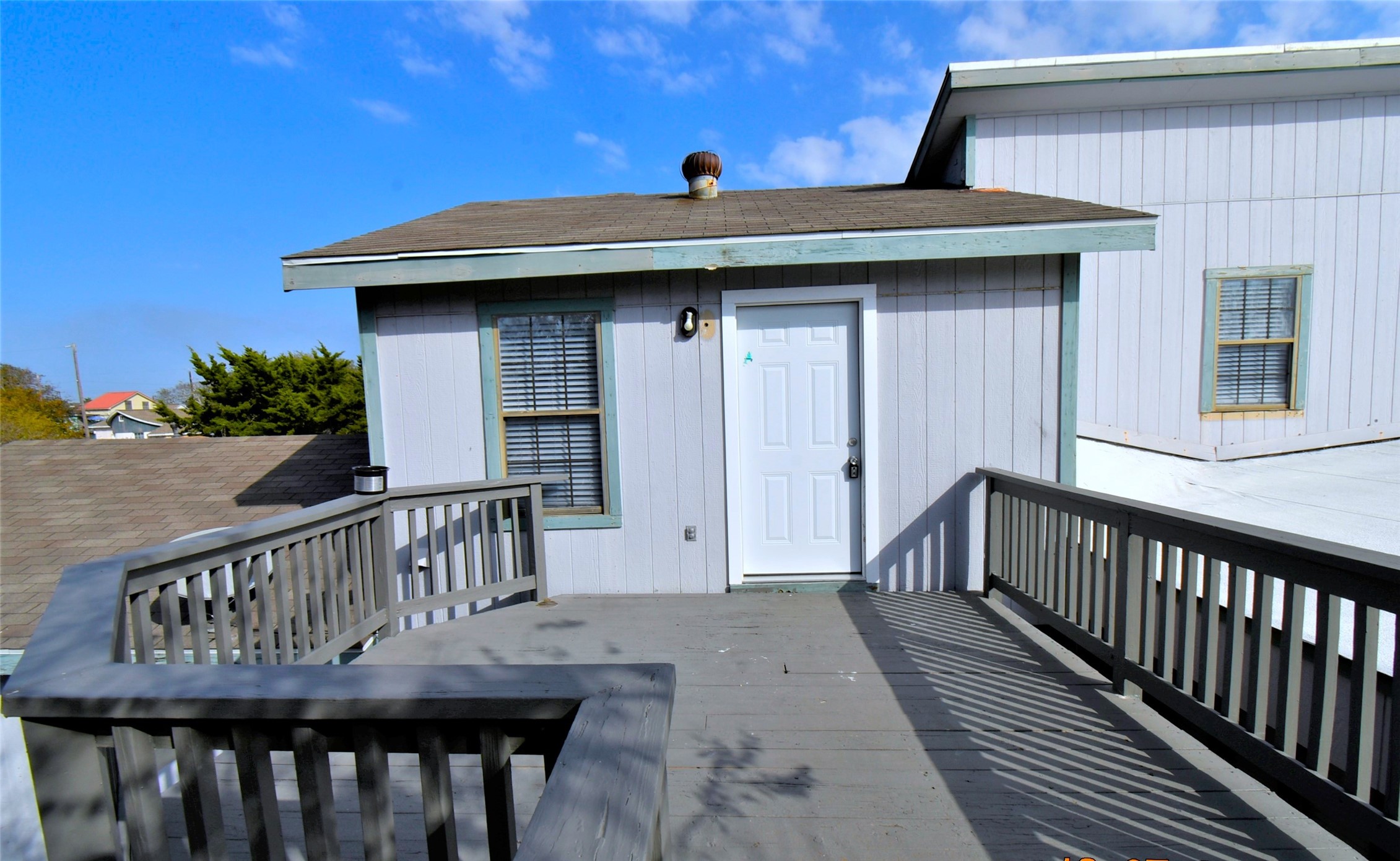 5405 Avenue R Galveston, TX 77551 - Photo 19 of 30 a view of a wooden house with a deck