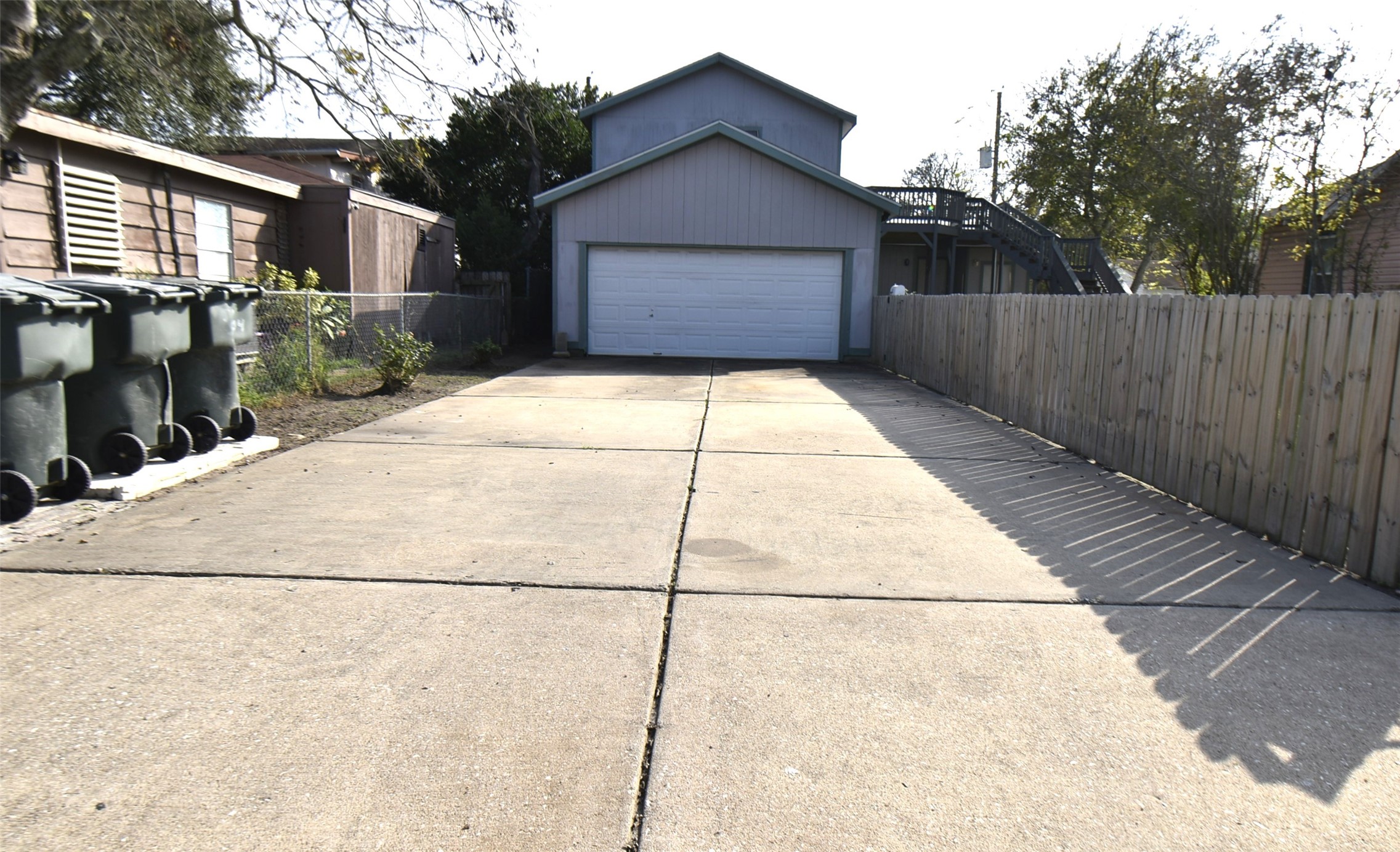 5405 Avenue R Galveston, TX 77551 - Photo 2 of 30 a house view with wooden fence