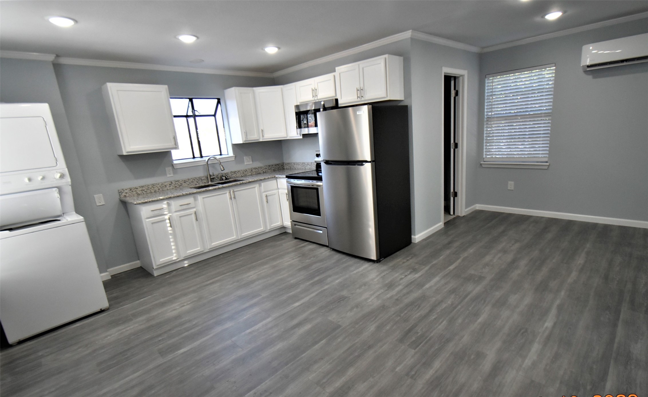 5405 Avenue R Galveston, TX 77551 - Photo 21 of 30 a kitchen with stainless steel appliances a refrigerator sink and microwave