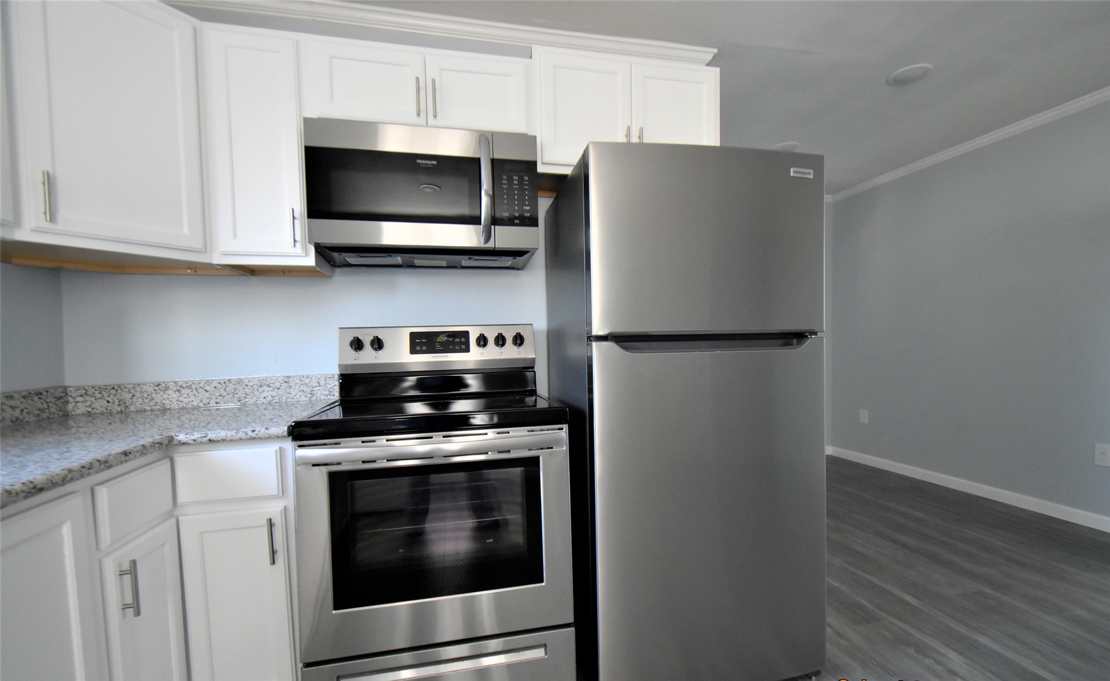 5405 Avenue R Galveston, TX 77551 - Photo 22 of 30 a kitchen with stainless steel appliances a stove a microwave and sink