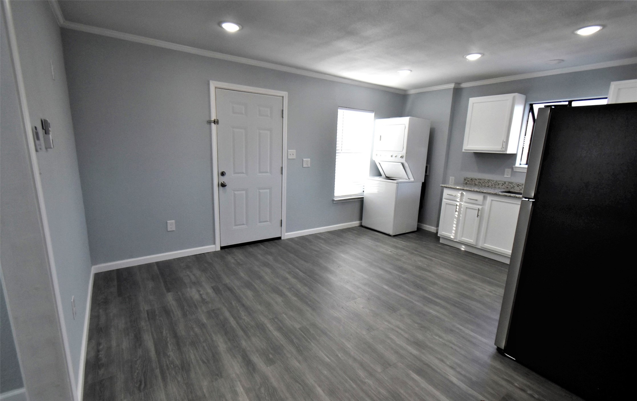 5405 Avenue R Galveston, TX 77551 - Photo 24 of 30 a view of a kitchen with wooden floor and electronic appliances