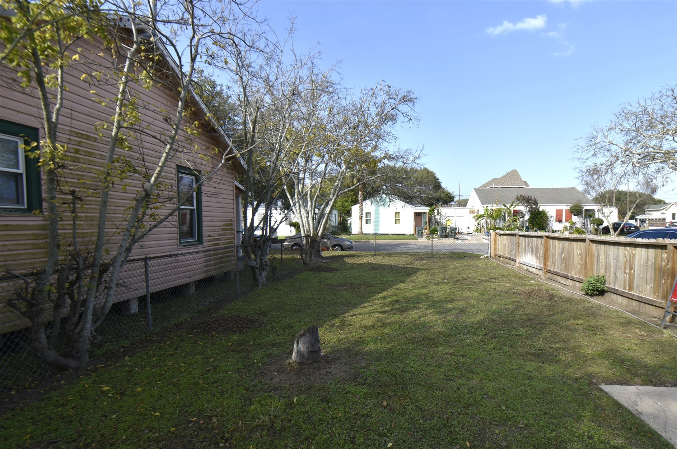 5405 Avenue R Galveston, TX 77551 - Photo 3 of 30 a view of yard and tree s