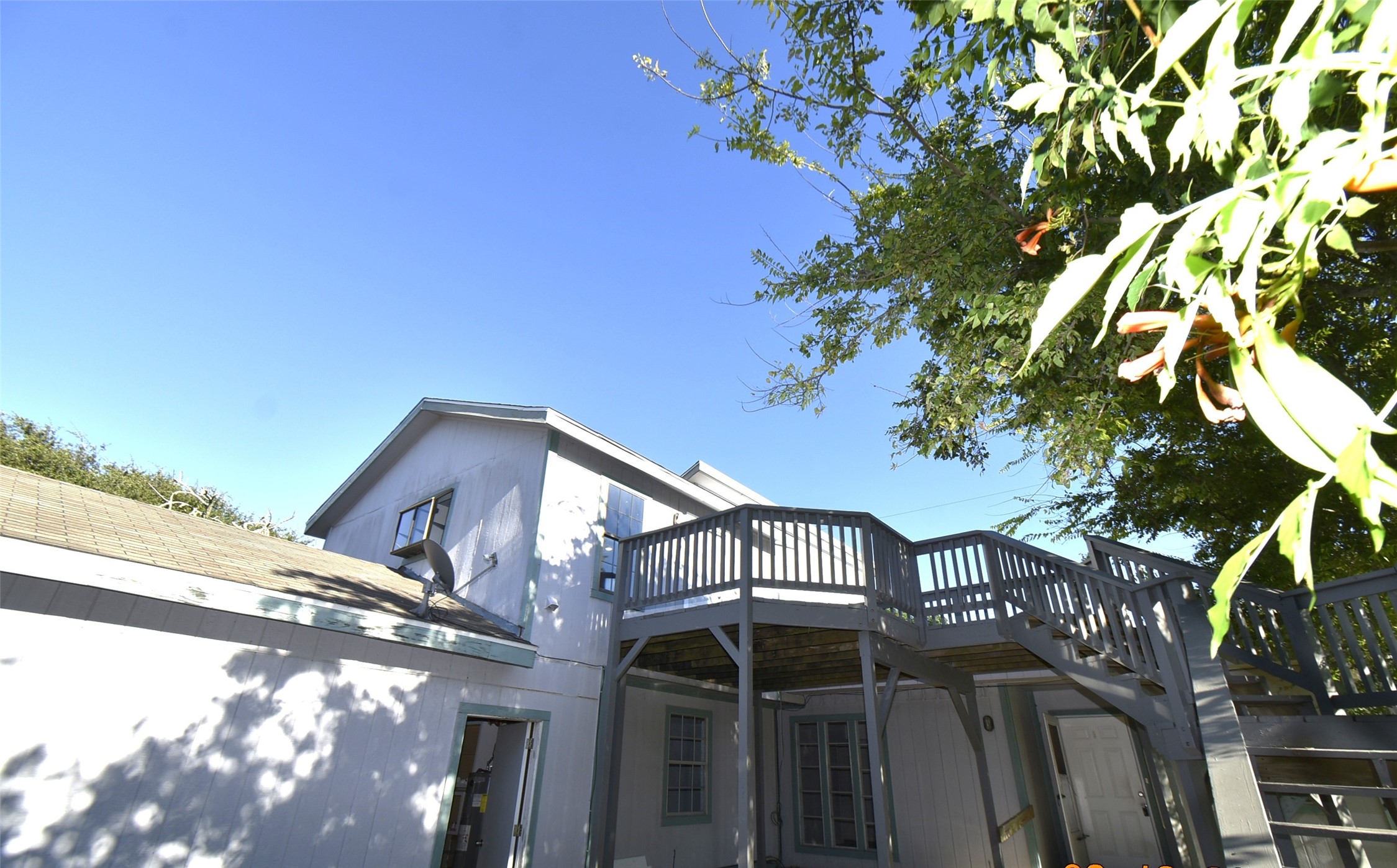 5405 Avenue R Galveston, TX 77551 - Photo 4 of 30 a view of a house with a tree