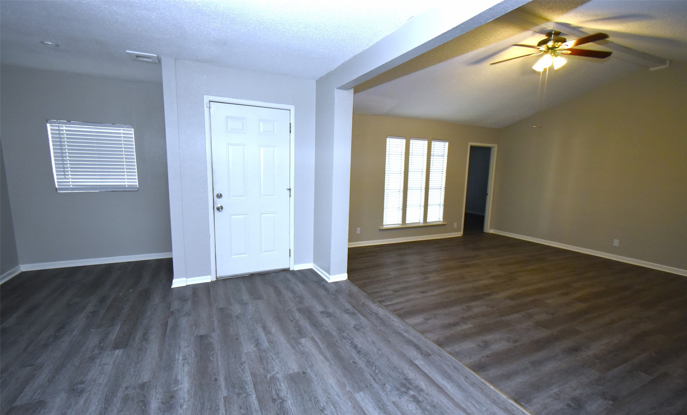 5405 Avenue R Galveston, TX 77551 - Photo 6 of 30 an empty room with wooden floor and windows