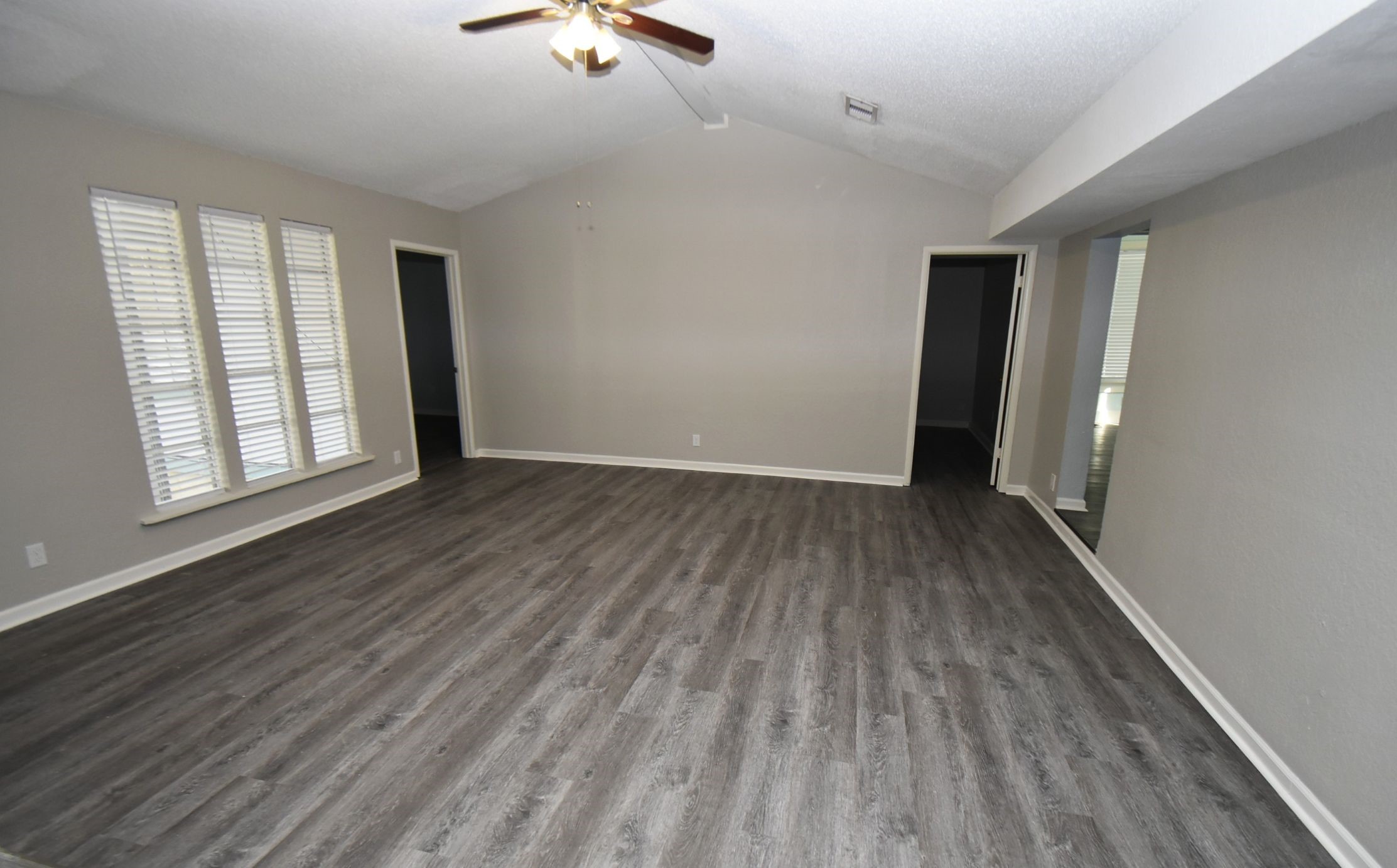 5405 Avenue R Galveston, TX 77551 - Photo 7 of 30 wooden floor in an empty room with a window
