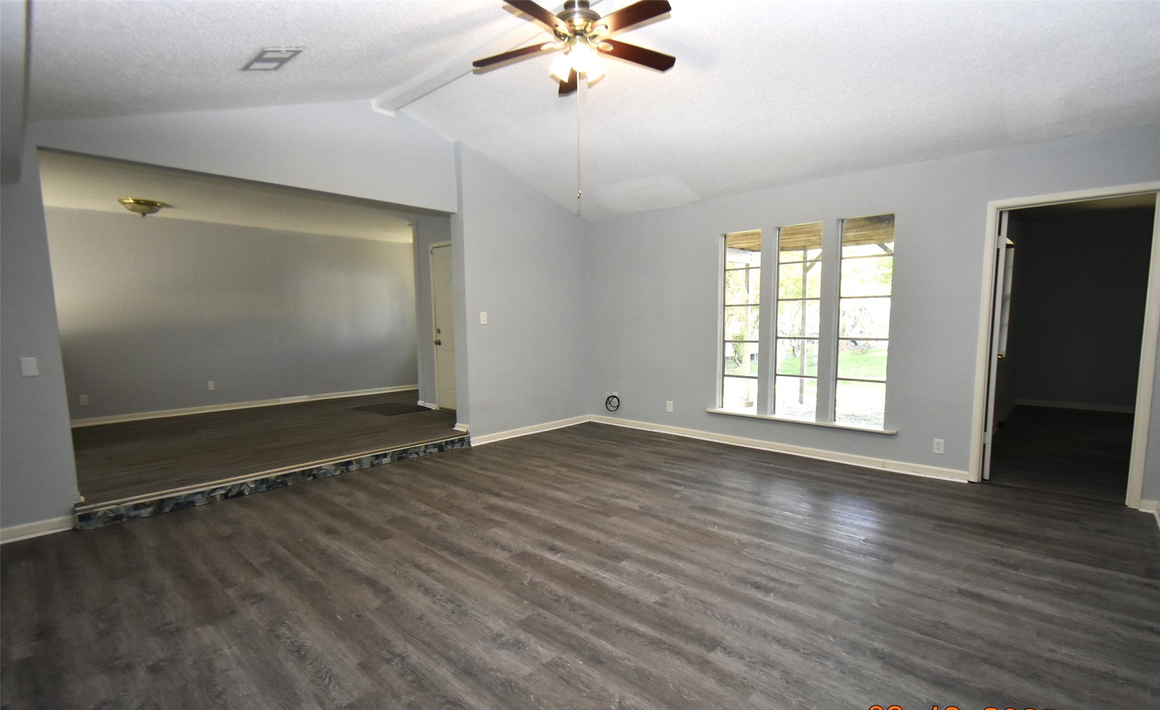 5405 Avenue R Galveston, TX 77551 - Photo 8 of 30 wooden floor in an empty room with a window
