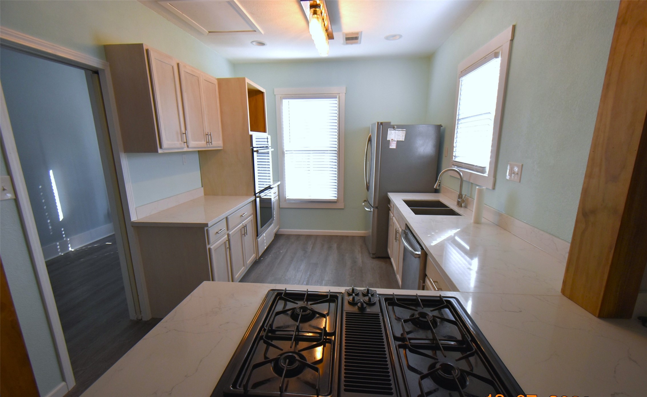 5405 Avenue R Galveston, TX 77551 - Photo 9 of 30 a view of kitchen and wooden floor
