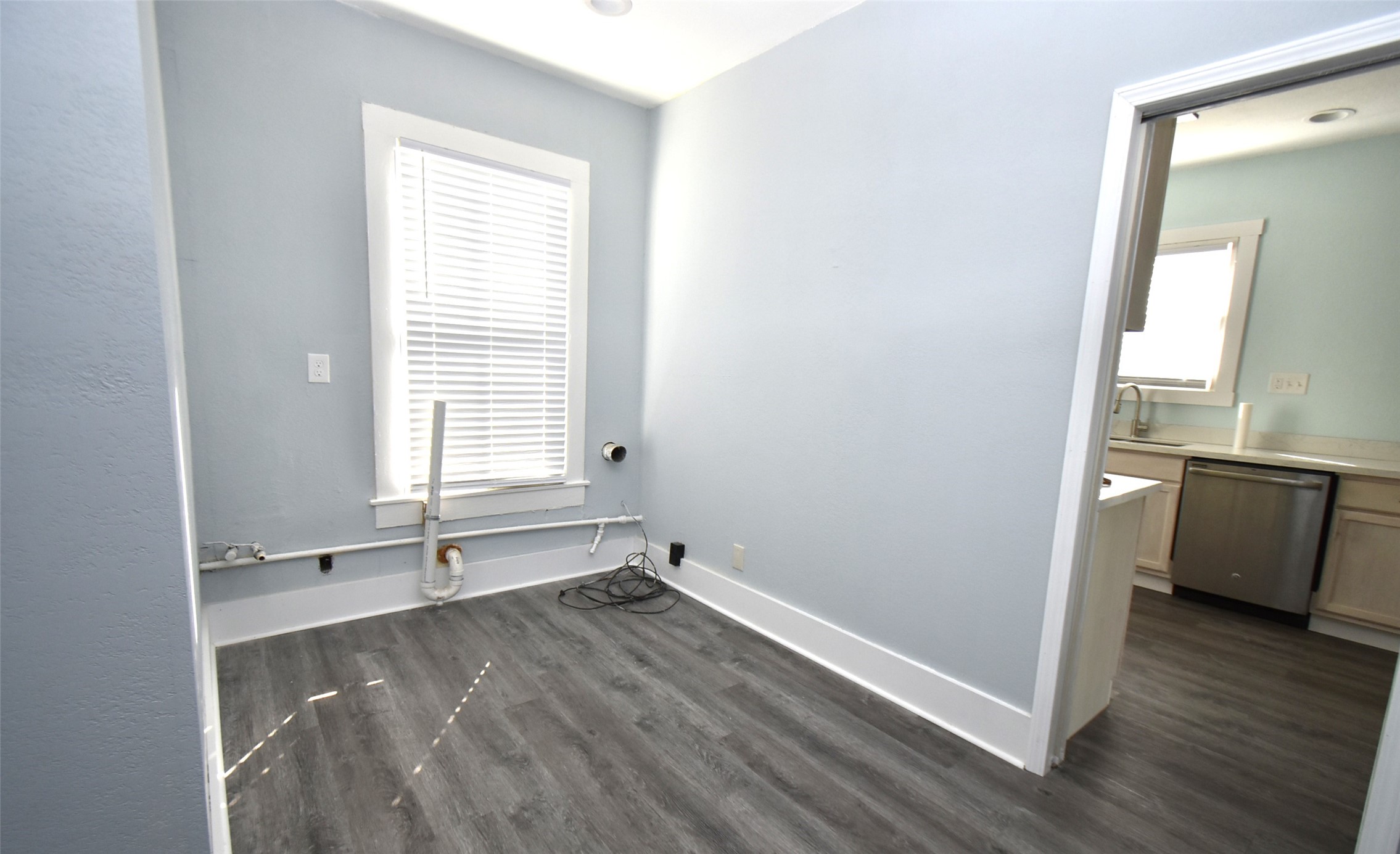 5405 Avenue R Galveston, TX 77551 - Photo 10 of 30 a view of a room with wooden floor and electronic appliances