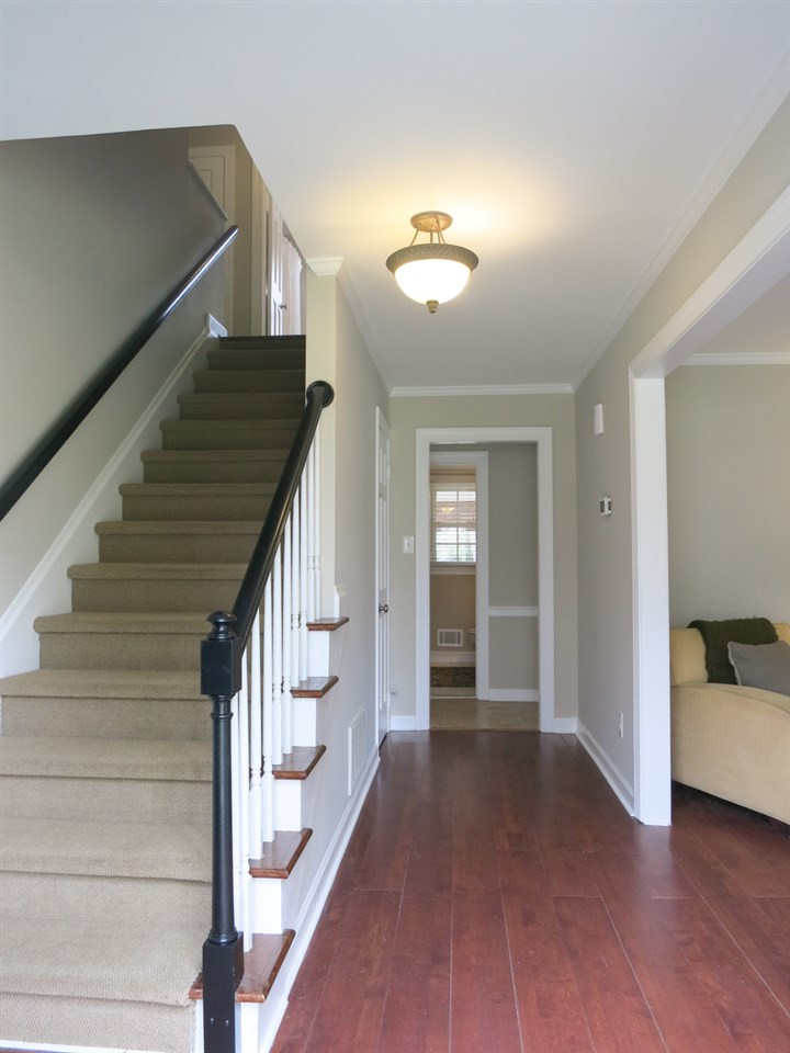 4713 Pemberton Drive Raleigh, NC 27609 - Photo 3 of 25 Welcoming Foyer w/coat closet, laminate wood flr & staircase w/berber carpet. 7 yr old Roof, Brand NEW Water Water Htr, 2 yr old dishwasher, fresh interior paint, new light fixtures/CFs; dark hardwd flrs up & down, crown molding throughout. Foyer