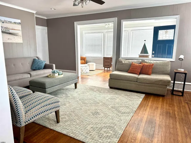 a living room with furniture and a rug
