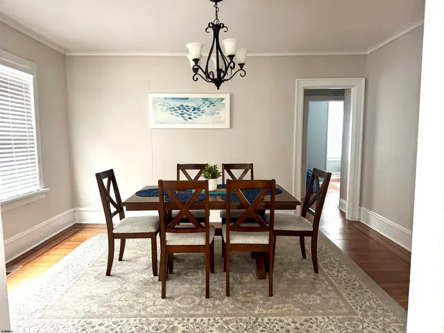 a view of a dining room with furniture and window