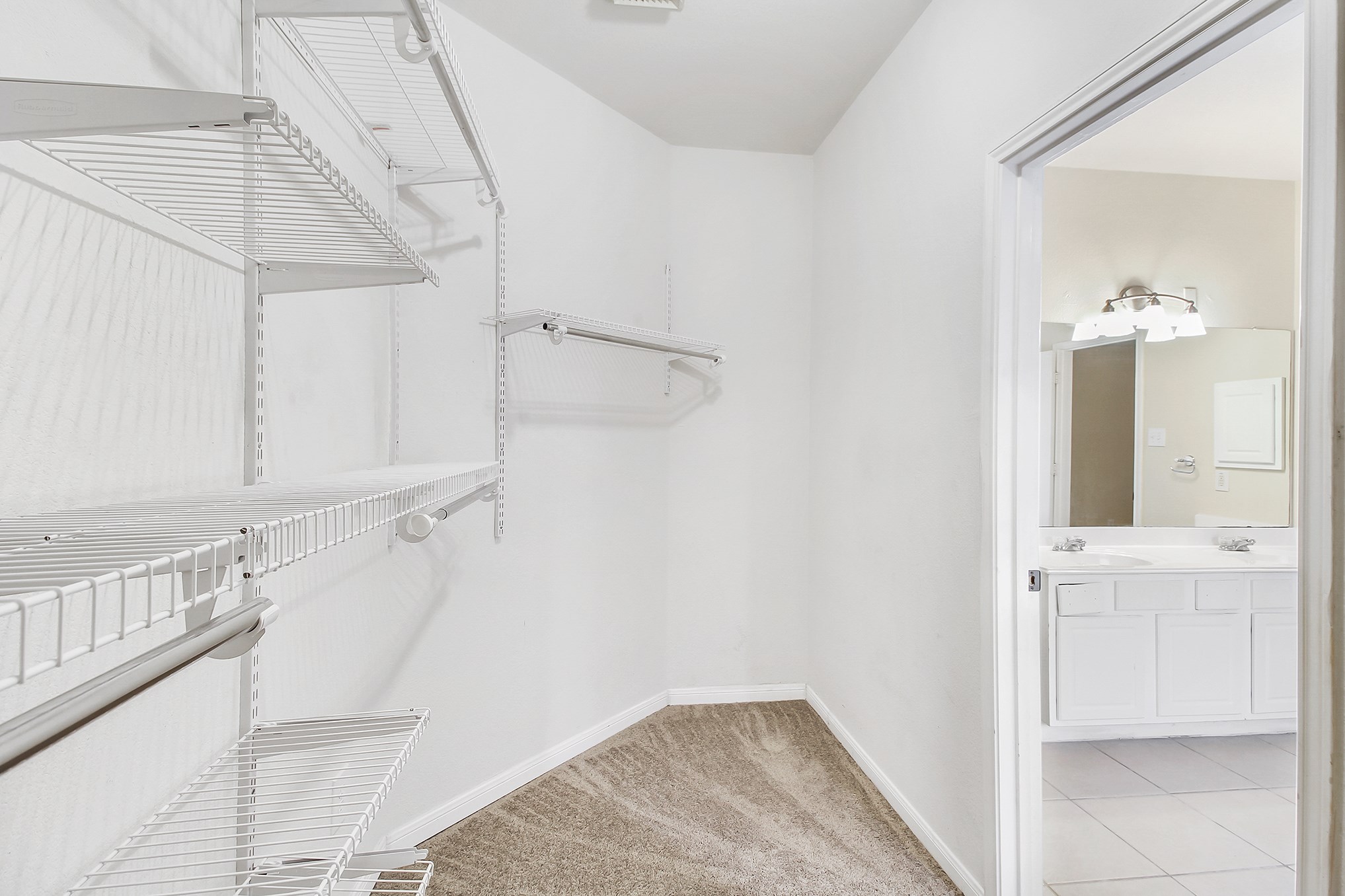 1814 Parkfair Court Katy, TX 77450 - Photo 26 of 36 Primary's walk-in closet! Built in shelving.