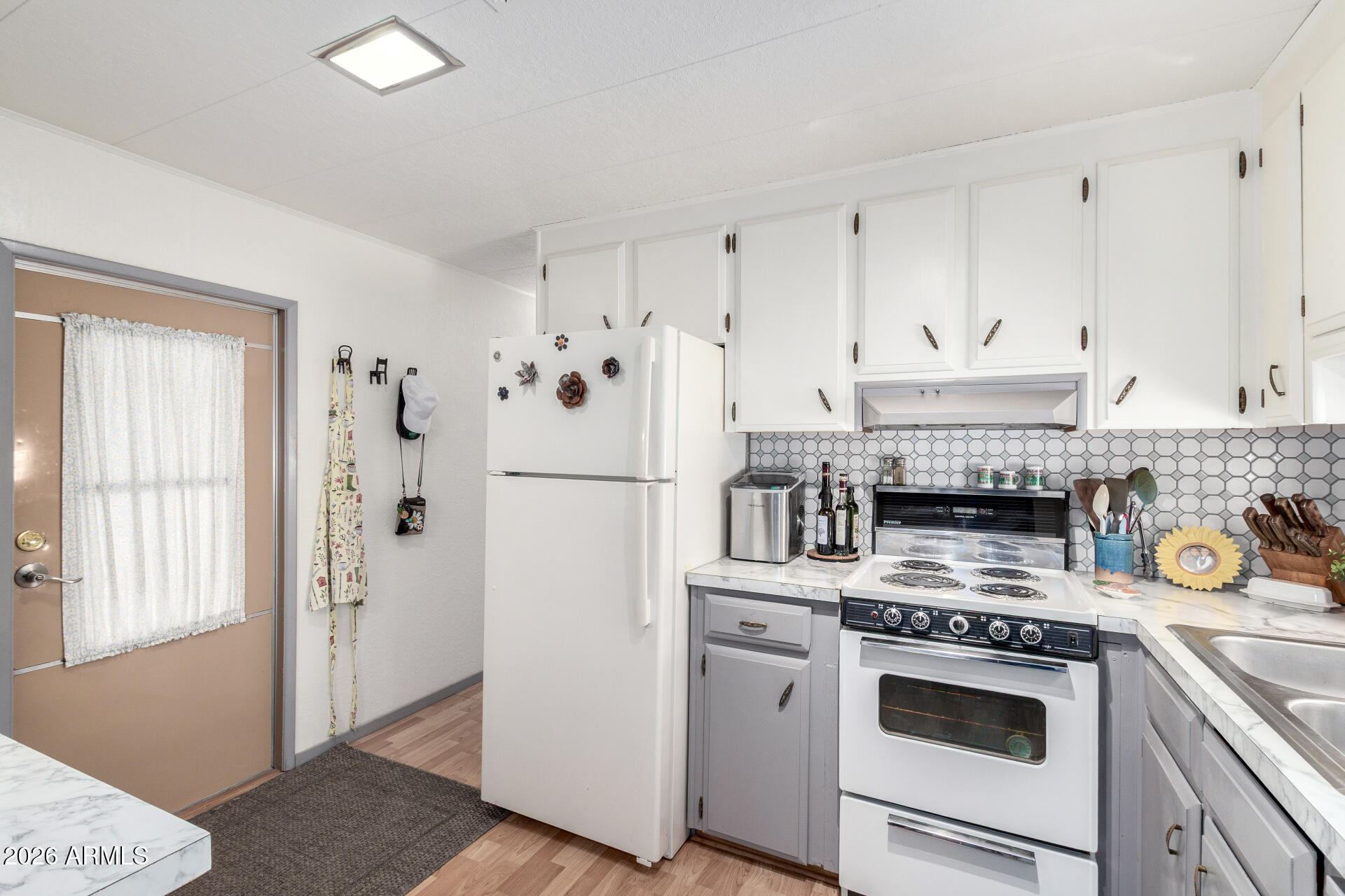 800 West Apache Trail, Unit 93 Apache Junction, AZ 85120 - Photo 4 of 28 a kitchen with stainless steel appliances granite countertop a refrigerator and a stove top oven