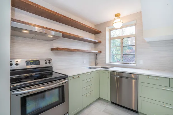 a kitchen with a stove and a sink