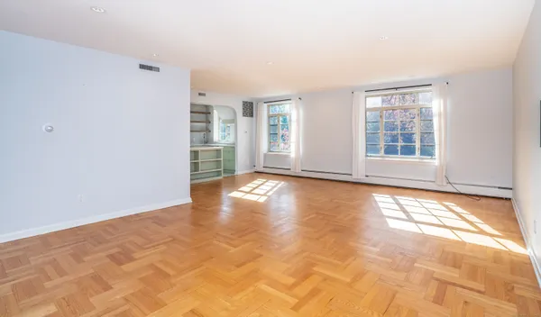 a view of an empty room with a window