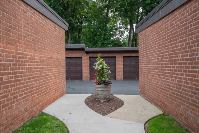 a view of a house with a potted plant