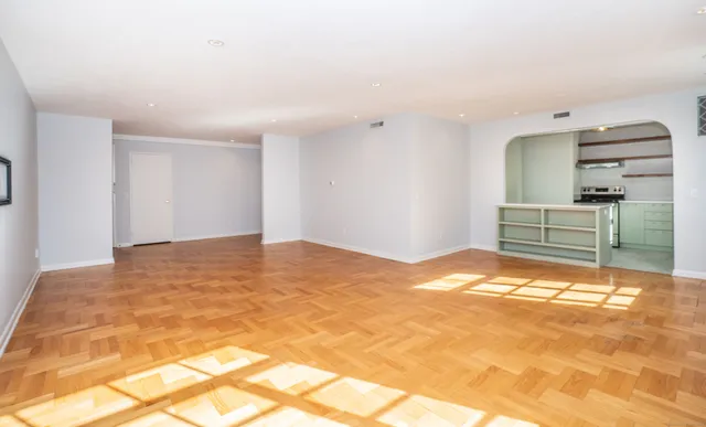 a view of a bedroom with a bed and cabinets