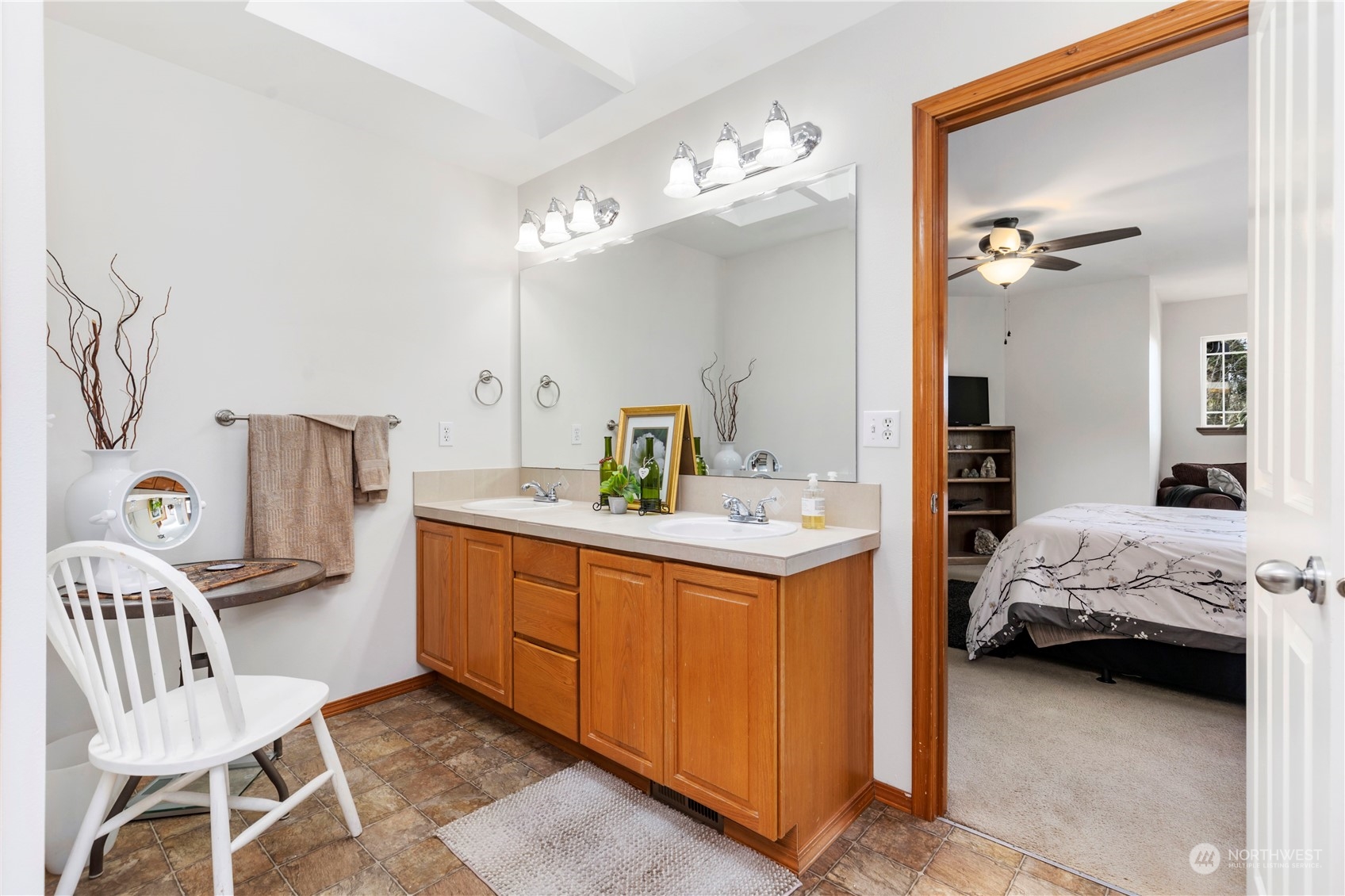 4712 152nd Place Southeast Bothell, WA 98012 - Photo 21 of 31 a en suite bathroom with a sink and a mirror