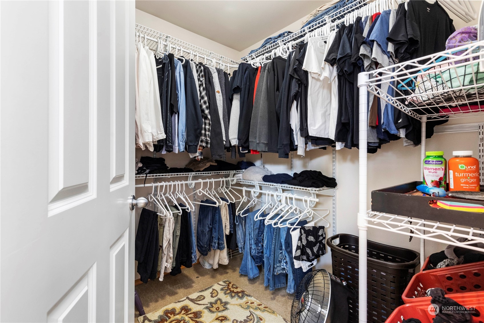 4712 152nd Place Southeast Bothell, WA 98012 - Photo 23 of 31 a view of walk in closet with clothes and shoes