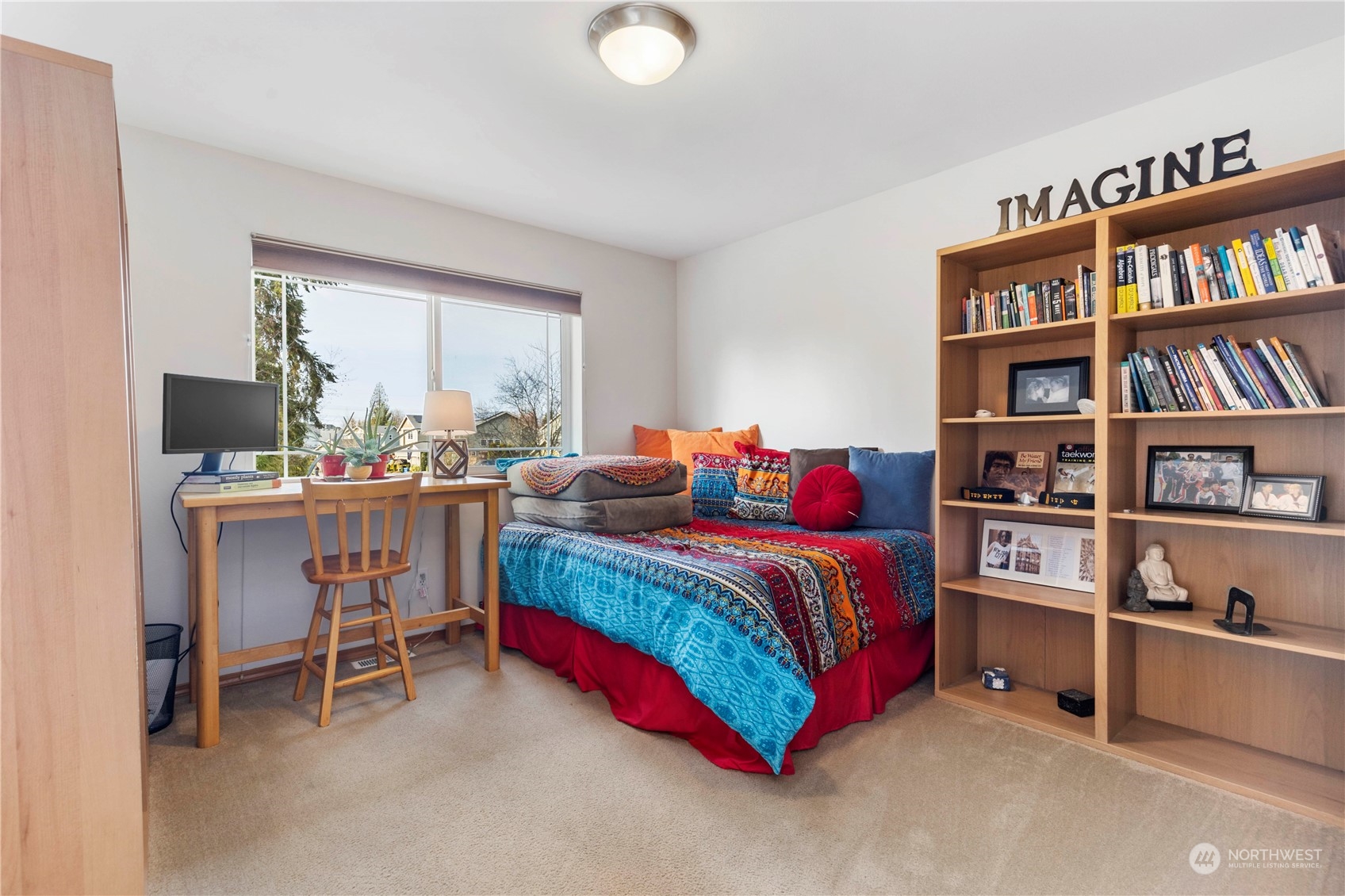 4712 152nd Place Southeast Bothell, WA 98012 - Photo 24 of 31 a bedroom with a bed and a book shelf