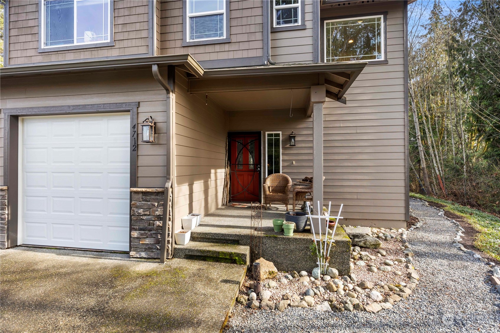 4712 152nd Place Southeast Bothell, WA 98012 - Photo 3 of 31 a front view of a house with a patio
